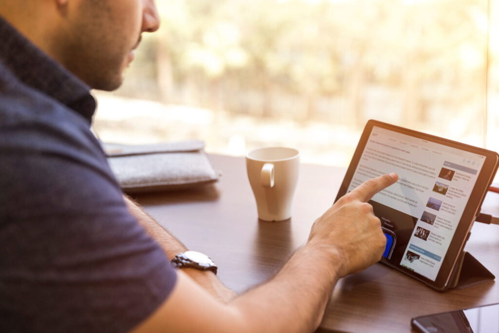 Man interacting with tablet